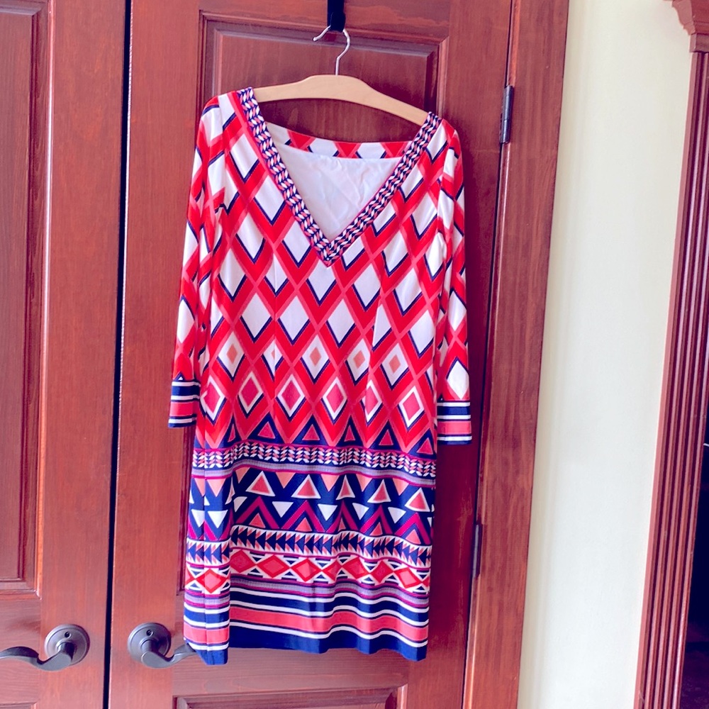 Coral w/ blue geometric design. Jersey material.